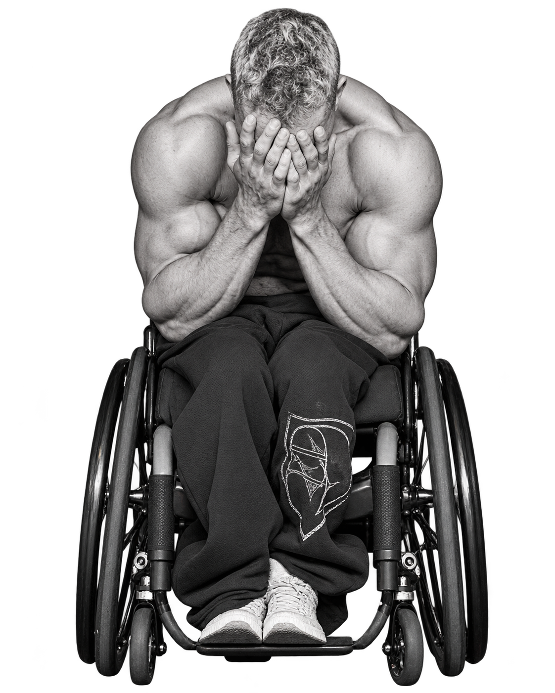 Bray seated onstage with his palms covering his face.